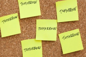 a cork board of post it notes that say 'tomorrow'